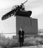 Jim Kinnear in front of a T-34-76 (with a wreath around the gun barrel) at Volgograd