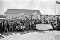 “Members of UAW Local 216 and their Women’s Auxiliary demonstrate their concern with the slowness in the change from civilian production to defense work in their General Motors plant, Southgate, California”, photo and caption from Reuther.wayne.edu