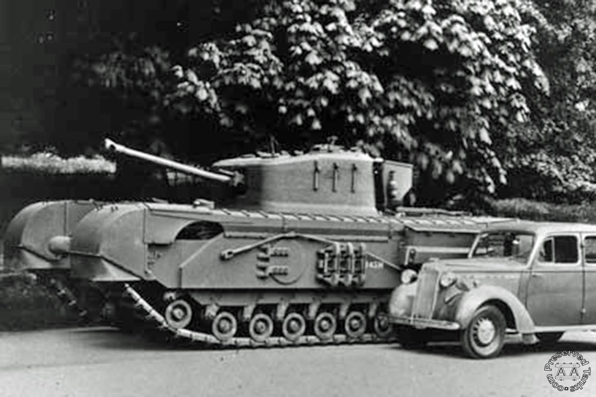 A publicity shot of a Churchill tank built at the Vauxhall works alongside one of the cars built there, photo from BBC.co.uk