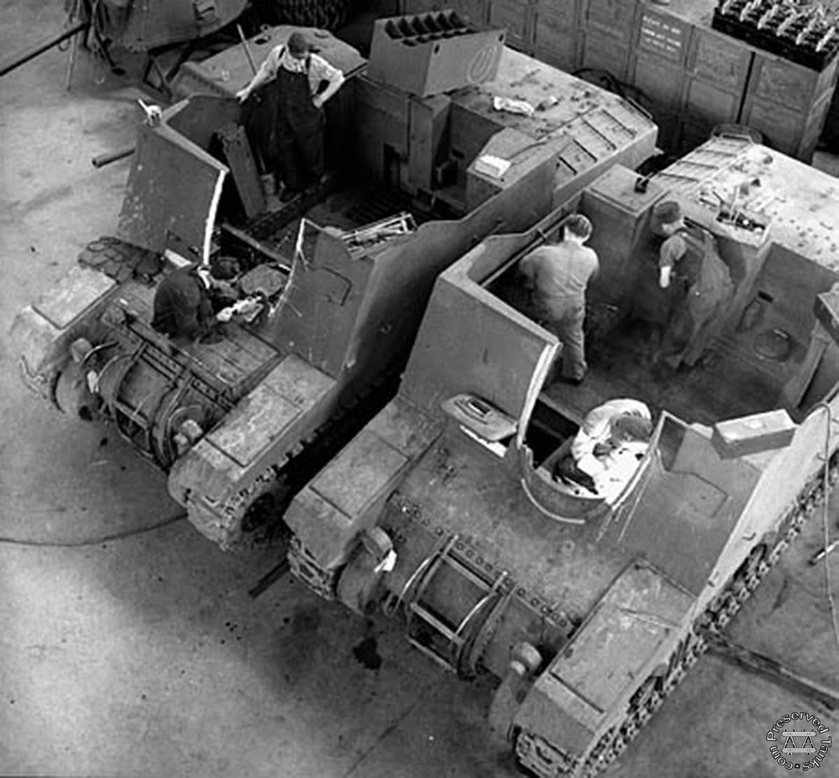 “Workmen put the finishing touches on almost completed Montreal Locomotive tanks assembled at the Montreal Locomotive Works plant” - vehicles are Sexton self-propelled guns