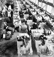 “Workmen complete assembly on Montreal Locomotive Works tanks; a welding operation is completed on a tank in the centre of the photo” - vehicles in the foreground are Sexon self-propelled guns, the remainder are M4A1 Sherman Grizzly tanks