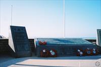 Memorials beside the museum overlooking the beach
