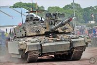 A British Army Challenger 2 takes a turn around the arena
