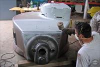 Turret being painted with primer